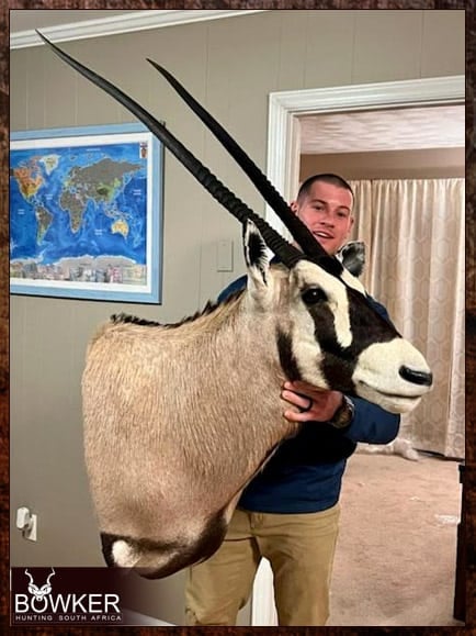 Client receiving gemsbok shoulder mount in the United States after successful African hunt.